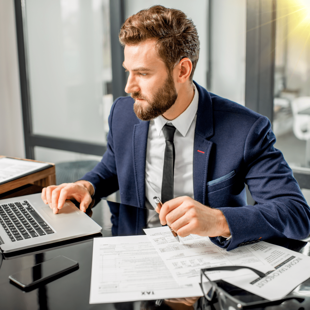 Man in Suit in an Office doing Research for Tax Incentives for Solar in South Carolina